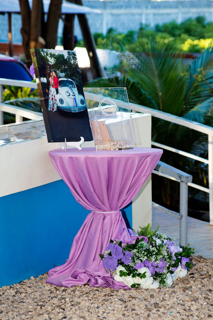 Beautifully decorated table with floral arrangement at an outdoor wedding in Puerto Plata.